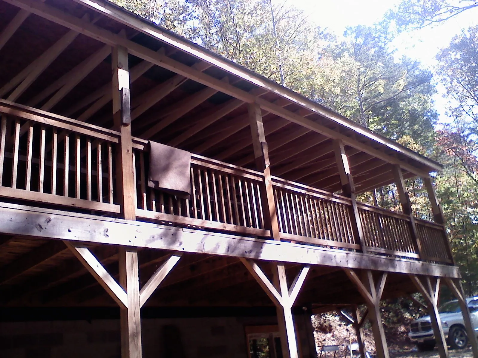 Timber framing under a new elevated porch and deck — Roof Leak Repair in Westfall by Roofing Brothers